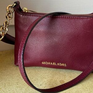 Michael Kors Dark Red Crossbody Bag with secure closure and lots of compartments